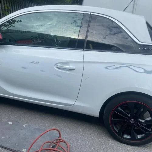 Keyed paintwork by vandals on a Vauxhall Adam Hatchback